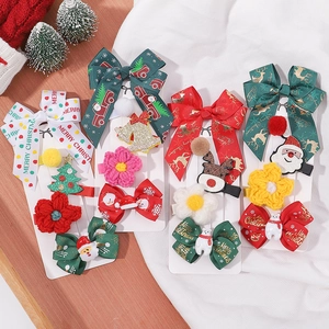 Christmas hair clips set for girls featuring bows Santa Claus and festive reindeer designs
