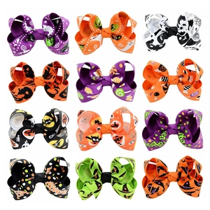 Set of 12 Halloween grosgrain ribbon hair bows featuring ghost and pumpkin patterns