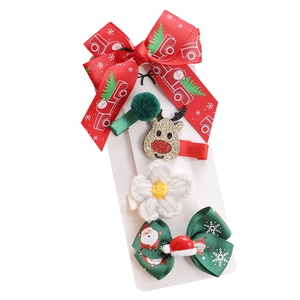 4-piece Christmas hair clip set with festive bows, sequin reindeer and knit flower
