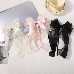 Detailed set of large chiffon bow hair clips in cream white, pink and black colors