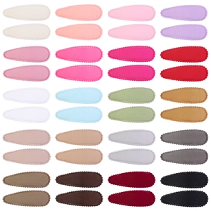 32-piece set of solid color scalloped edge drop clips with ribbed fabric covering