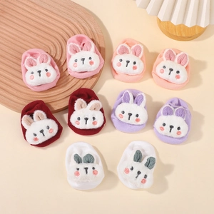 Detail of five assorted colors cotton baby socks with 3D plush rabbit doll decorations