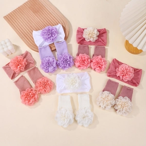 Detail showing baby headband and socks set with floral accents in multiple pastel colors