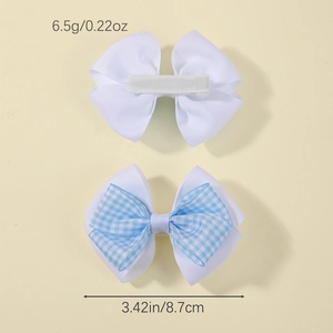 Détail de deux barrettes à nœud avec motif à carreaux bleus et mesures de la taille