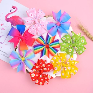 Set of 8 colorful grosgrain ribbon bow hair clips with rainbow and polka dot patterns