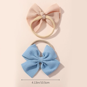 Set of two soft waffle texture bow nylon headbands for baby girls in pink and light blue