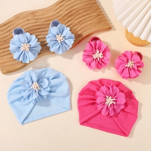 Baby headband and socks set with textured beanies and 3D floral accents in blue and pink