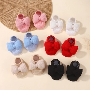 Detailed view of soft cotton infant bow socks in six various pastel and classic colors