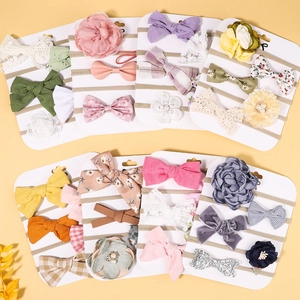 Eight-set assortment of handmade infant headbands featuring bows and floral lace accents