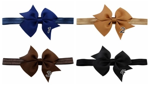 Detailed view of four colorful grosgrain ribbon bow headbands for babies and infants