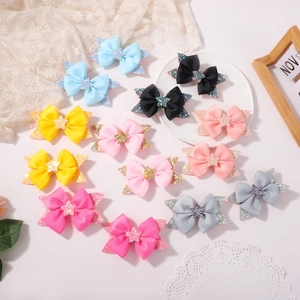 Set of cute colorful bow hair clips with stars for girls in various pastel shades