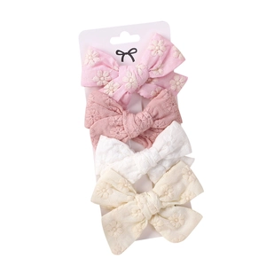 Set of 4 girls floral embroidered fabric bow hair clips in pastel pink and white colors