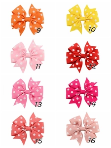 Close-up of eight polka dot grosgrain ribbon bows showing texture and vibrant colors