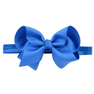 Handmade royal blue bow headband for babies featuring elastic soft fabric and ribbed bow