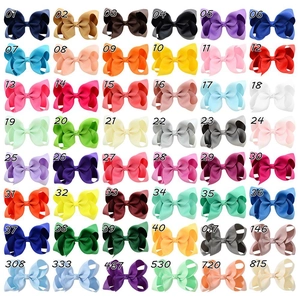 Grid layout showing 48 colors of high-quality grosgrain ribbon bow clips for kids