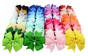 Detailed view of colorful grosgrain ribbon fishtail bows in various vibrant colors