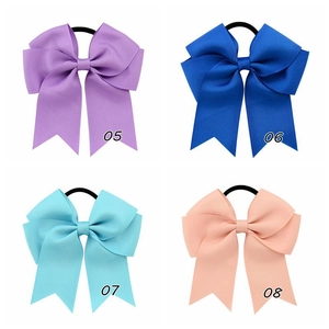 Detail view of 4.5-inch ribbed grosgrain ribbon hair bows in four distinct colors