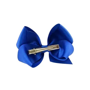 Blue grosgrain ribbon bow hair clip with silver metal alligator clamp on white back