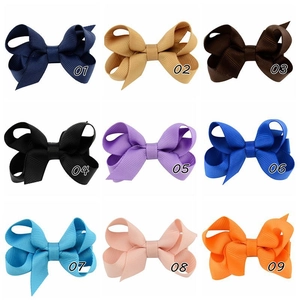 Detail view of 9-color ribbed ribbon hair clips collection for children and girls