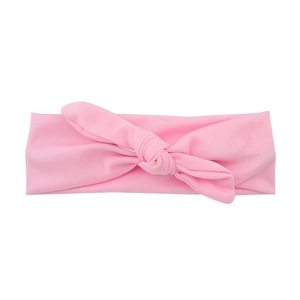 Bandeau élastique rose pour bébé avec grand nœud décoratif et texture douce en tricot