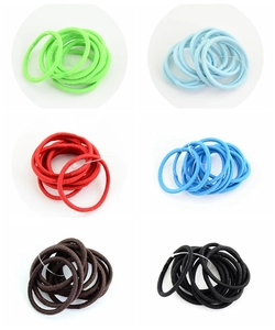 Detail view of colorful high-elasticity hair ties showing texture and various solid colors