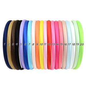 Detailed palette showing twenty assorted satin sponge headbands in vibrant candy colors