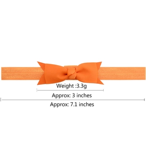 Orange ribbed grosgrain bow baby headband with elastic band and size measurements