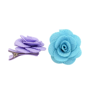 Handmade woolen camellia flower hair clips in purple and blue with metal alligator grips