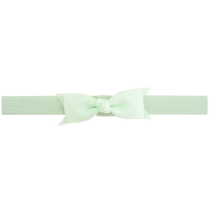 Detailed close-up of light green ribbed grosgrain bow on a soft elastic baby headband