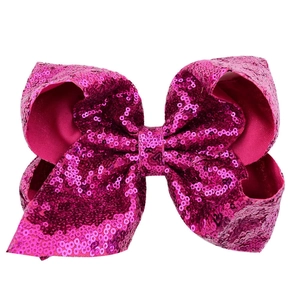 Sparkly 8 inch pink sequin hair bow clip for girls and toddlers on a white background