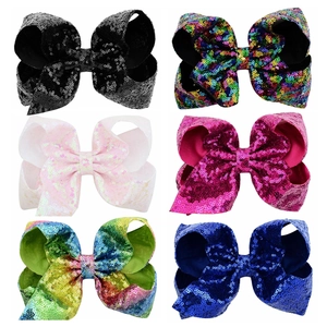 Detailed grid view of 8-inch large sequin hair bows in six vibrant multi-colors