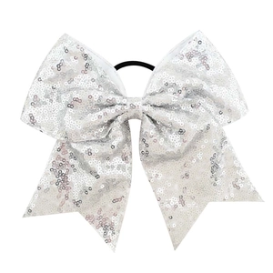 Detail view of large 8 inch sequin bow hair tie with silver sequins and black elastic band