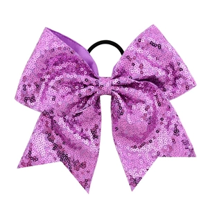 Detail of 8-inch purple sequin cheerleader bow with high-elastic black hair tie