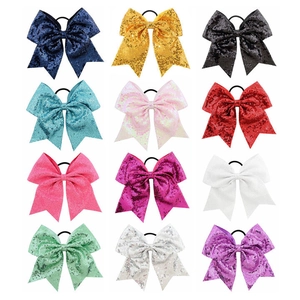 Set of twelve 8-inch sequin bow hair ties in assorted vibrant colors for girls