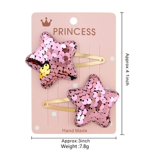 Pink sequin star hair clips for girls on a pink princess display card with gold metal base
