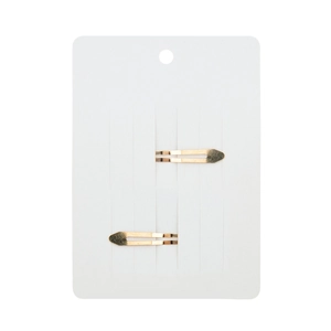 Detailed view of two golden metal hair clips displayed on a white retail cardboard card
