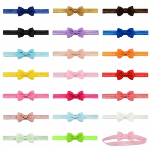 Wholesale children's ribbed bow headbands set in 20 vibrant colors with elastic bands
