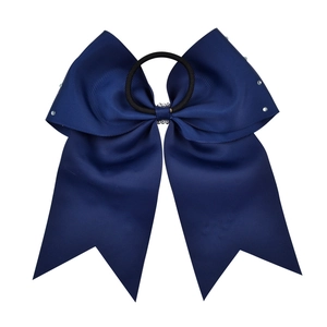 Close-up of navy blue 7-inch grosgrain ribbon bow with rhinestone center and elastic tie