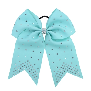 Detail of 7 inch turquoise cheer bow hair tie with silver rhinestones and elastic band