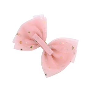 Barrette nœud en résille rose avec paillettes étoiles et lune sur fond blanc