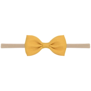 Vue détaillée d'un bandeau jaune à nœud en tissu côtelé avec sangle en nylon souple