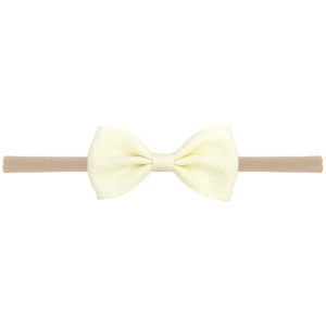 Bandeau élastique en nylon pour bébé avec un nœud en tissu beige texturé, mignon