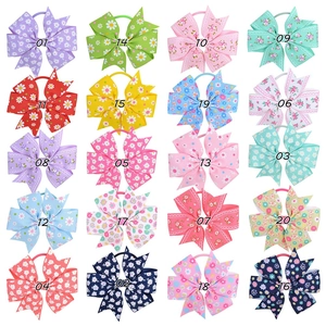 Detailed grid showing 20 colorful grosgrain ribbon fishtail bows with floral prints