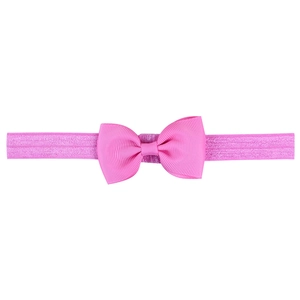 Detail view of the ribbed grosgrain ribbon bow on the elastic pink baby headband