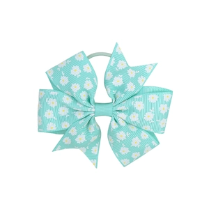 Detail of mint green grosgrain ribbon hair bow with white daisy print and elastic band