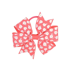 Detail of coral red grosgrain ribbon hair bow with white daisy print and elastic band