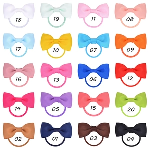 Grid display of 20 colorful grosgrain ribbon bow hair ties with individual style numbers