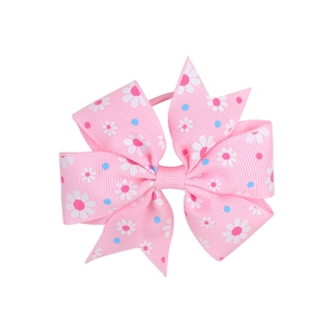Detail of pink grosgrain ribbon bow with daisy floral print and elastic hair tie