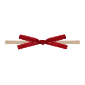 Close-up of a burgundy velvet bow headbands with soft nylon band for newborn babies