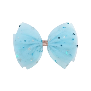 Detail of light blue layered chiffon bow hair clip with silver stars and moon patterns
